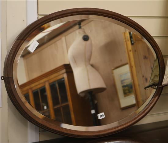 A Victorian oval wood mirror W.86cm